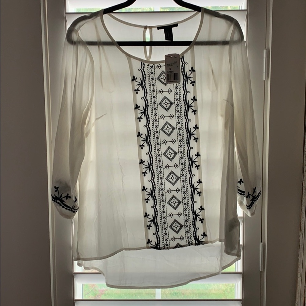 White and black print shirt